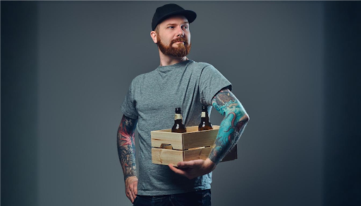 man holding beers in crate