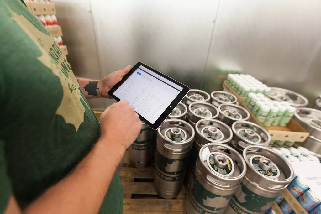 an employee using Ekos for sales order processing