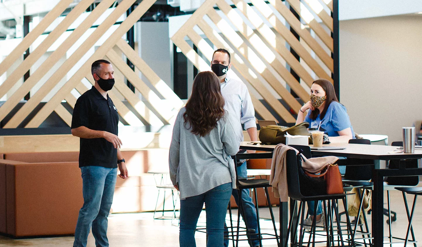 ekos employees gathered at a table